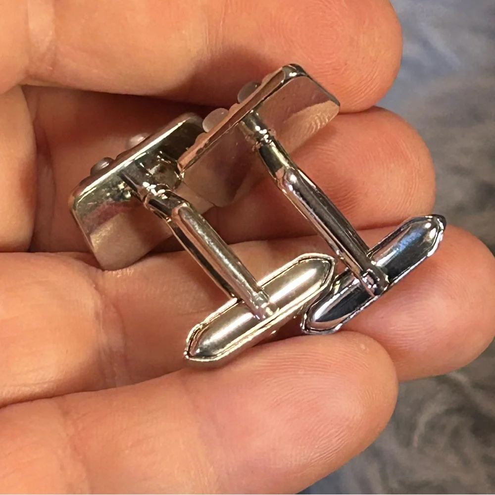 Modern gentleman’s cat eye glass bar tilt style cuff links
